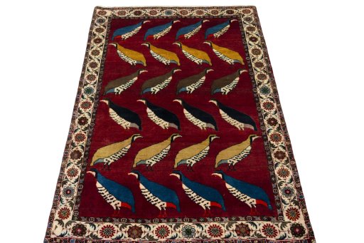 Surface texture of 2000s Persian Gabbeh rug with natural Wool and intricate pattern
