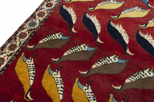 Backside of handmade 2000s Persian Gabbeh rug showing knot structure and weave density