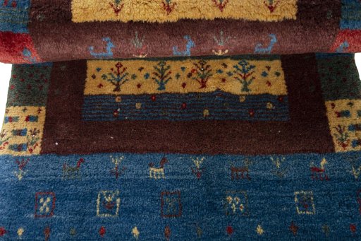 Full view of 2000s Persian Gabbeh rug from Iran / Persia, 132 × 83 cm in Multi Color tones