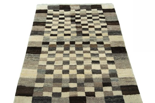 Surface texture of 2000s Persian Gabbeh rug with natural Wool and intricate pattern