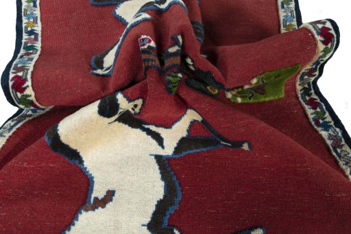 Corner detail of 2000s Persian Gabbeh rug showing border pattern and Wool pile