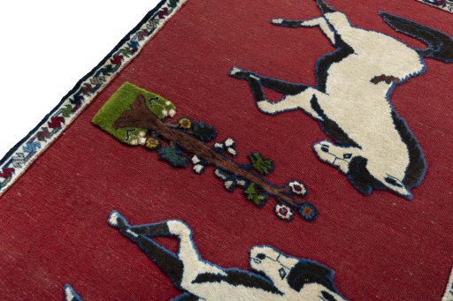 Backside of handmade 2000s Persian Gabbeh rug showing knot structure and weave density