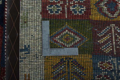 Close-up detail of 2000s Persian Gabbeh rug from Iran / Persia showing Wool weave