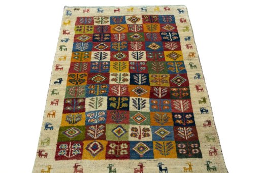 Surface texture of 2000s Persian Gabbeh rug with natural Wool and intricate pattern