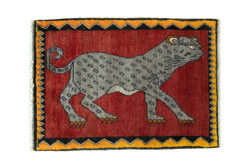Full view of 2000s Persian Gabbeh rug from Iran / Persia, 91 × 66 cm in Red tones