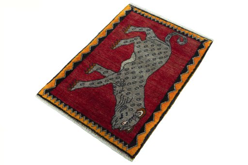 Corner detail of 2000s Persian Gabbeh rug showing border pattern and Wool pile