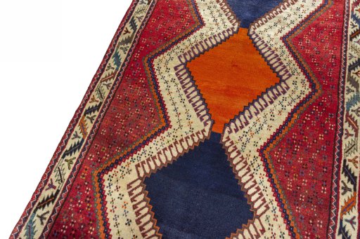 Backside of handmade 2000s Persian Gabbeh rug showing knot structure and weave density