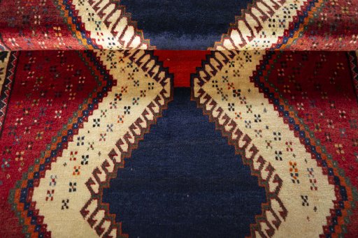 Full view of 2000s Persian Gabbeh rug from Iran / Persia, 178 × 111 cm in Red tones