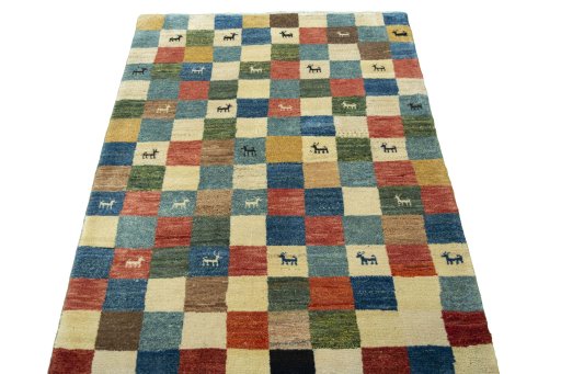 Surface texture of 2000s Persian Gabbeh rug with natural Wool and intricate pattern