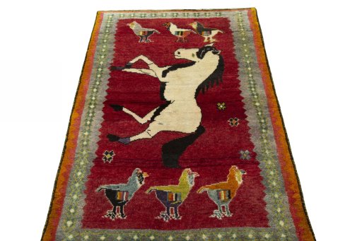Surface texture of 2000s Persian Gabbeh rug with natural Wool and intricate pattern