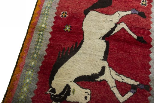 Backside of handmade 2000s Persian Gabbeh rug showing knot structure and weave density
