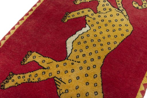Backside of handmade 2000s Persian Gabbeh rug showing knot structure and weave density