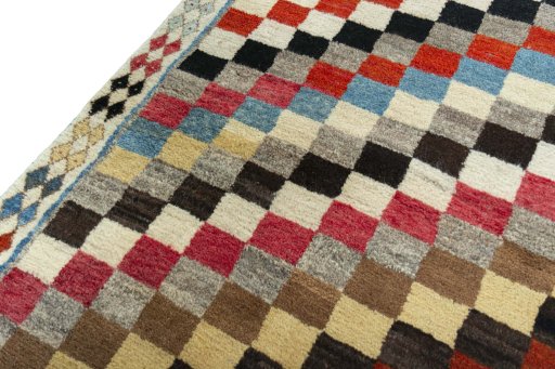 Backside of handmade 2000s Persian Gabbeh rug showing knot structure and weave density