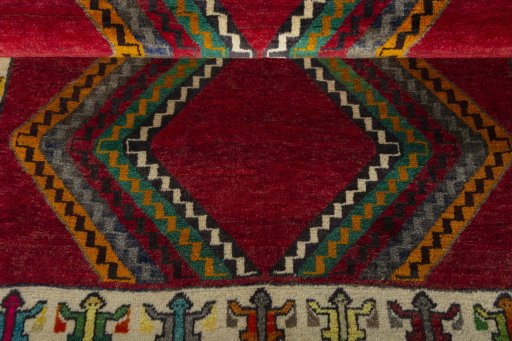 Full view of 2000s Persian Gabbeh rug from Iran / Persia, 152 × 108 cm in Red tones