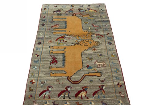 Surface texture of 2000s Persian Gabbeh rug with natural Wool and intricate pattern