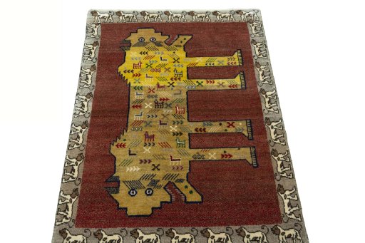 Surface texture of 2000s Persian Gabbeh rug with natural Wool and intricate pattern