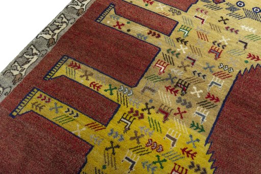 Backside of handmade 2000s Persian Gabbeh rug showing knot structure and weave density