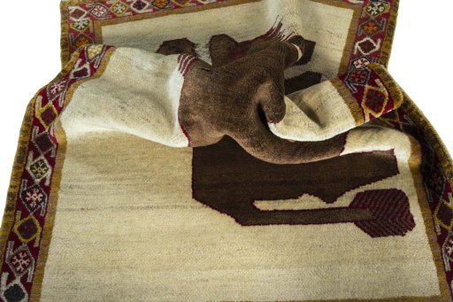 Corner detail of 2000s Persian Gabbeh rug showing border pattern and Wool pile