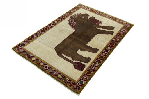 Corner detail of 2000s Persian Gabbeh rug showing border pattern and Wool pile