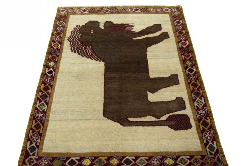 Surface texture of 2000s Persian Gabbeh rug with natural Wool and intricate pattern
