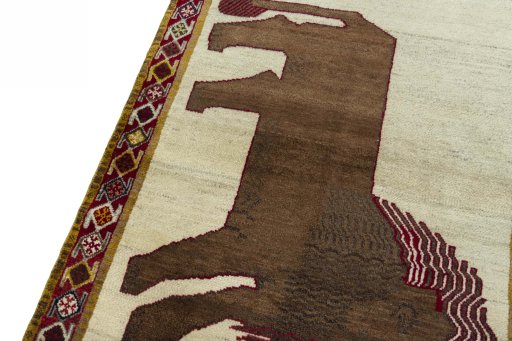 Backside of handmade 2000s Persian Gabbeh rug showing knot structure and weave density