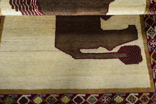 Full view of 2000s Persian Gabbeh rug from Iran / Persia, 156 × 108 cm in Beige tones