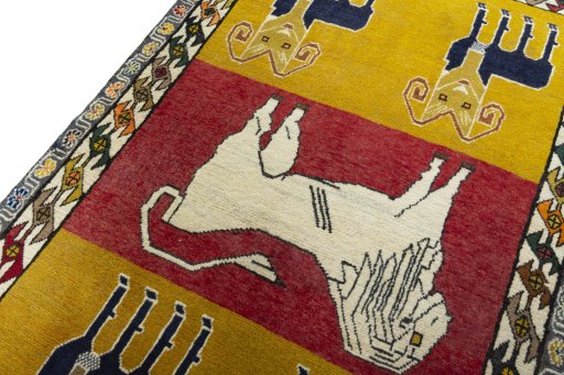 Backside of handmade 2000s Persian Gabbeh rug showing knot structure and weave density