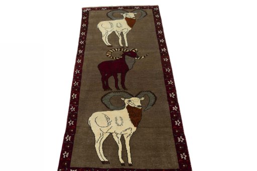Surface texture of 2000s Persian Gabbeh rug with natural Wool and intricate pattern