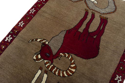 Backside of handmade 2000s Persian Gabbeh rug showing knot structure and weave density