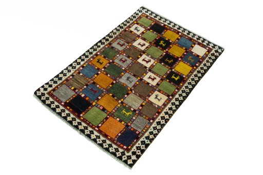 Corner detail of 2000s Persian Gabbeh rug showing border pattern and Wool pile