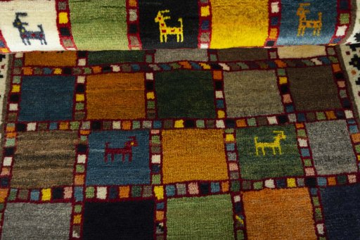 Full view of 2000s Persian Gabbeh rug from Iran / Persia, 124 × 80 cm in Multi Color tones