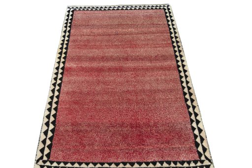 Surface texture of 2000s Persian Gabbeh rug with natural Wool and intricate pattern