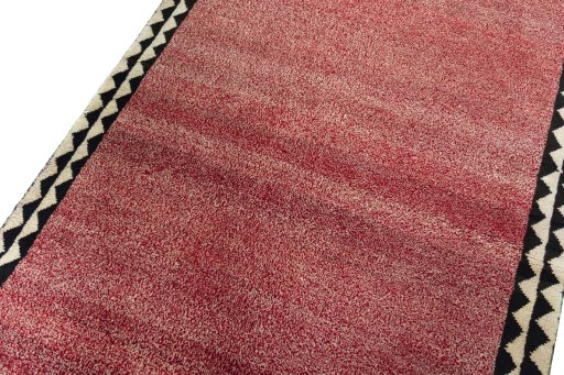 Backside of handmade 2000s Persian Gabbeh rug showing knot structure and weave density