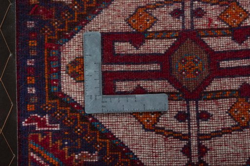 Backside of handmade 2000s Persian Gabbeh rug showing knot structure and weave density