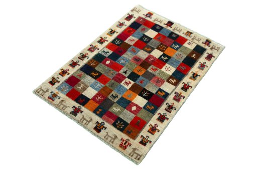 Corner detail of 2000s Persian Gabbeh rug showing border pattern and Wool pile