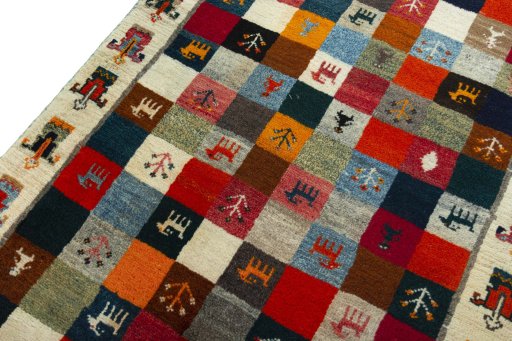 Backside of handmade 2000s Persian Gabbeh rug showing knot structure and weave density