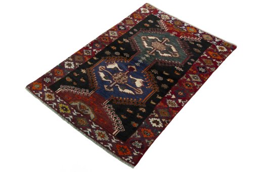 Corner detail of 2000s Persian Gabbeh rug showing border pattern and Wool pile