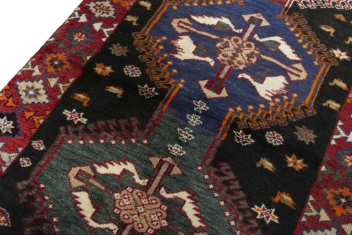 Backside of handmade 2000s Persian Gabbeh rug showing knot structure and weave density