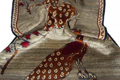 Corner detail of 2000s Persian Gabbeh rug showing border pattern and Wool pile