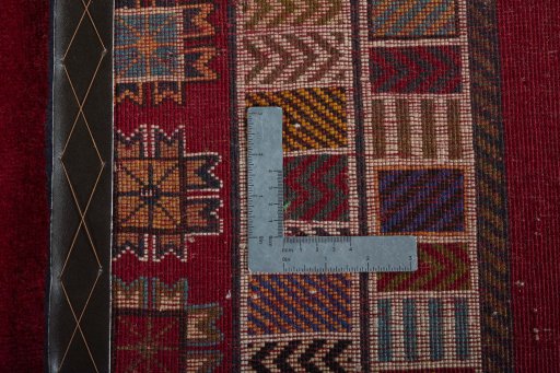 Surface texture of 2000s Persian Gabbeh rug with natural Wool and intricate pattern