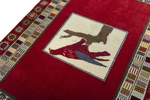 Backside of handmade 2000s Persian Gabbeh rug showing knot structure and weave density