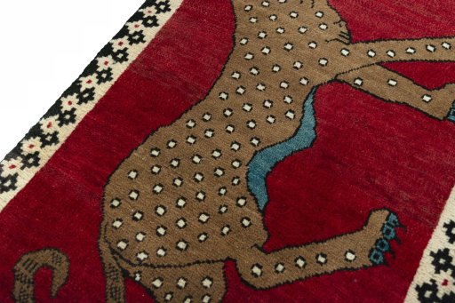 Backside of handmade 2000s Persian Gabbeh rug showing knot structure and weave density