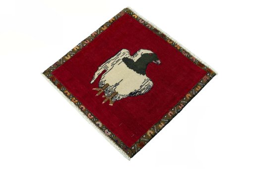 Corner detail of 2000s Persian Gabbeh rug showing border pattern and Wool pile