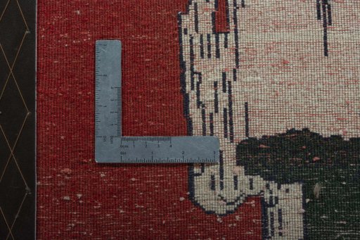 Backside of handmade 2000s Persian Gabbeh rug showing knot structure and weave density