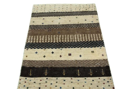 Surface texture of 2000s Persian Gabbeh rug with natural Wool and intricate pattern