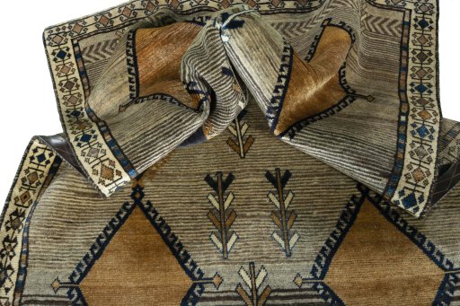 Corner detail of 1970s Persian Gabbeh rug showing border pattern and Wool pile