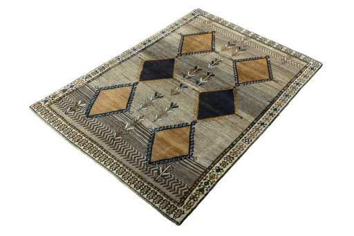 Corner detail of 1970s Persian Gabbeh rug showing border pattern and Wool pile