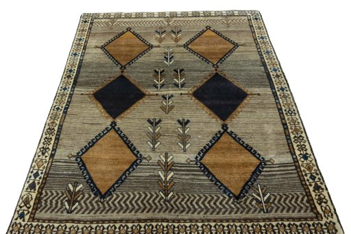 Surface texture of 1970s Persian Gabbeh rug with natural Wool and intricate pattern