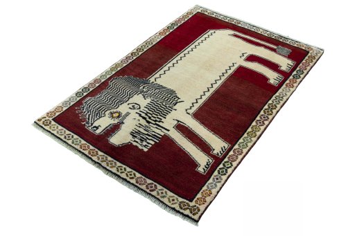 Corner detail of 2000s Persian Gabbeh rug showing border pattern and Wool pile