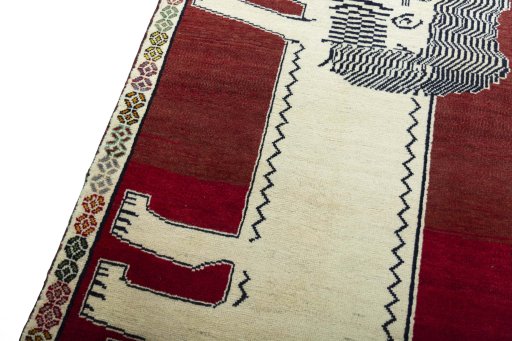 Backside of handmade 2000s Persian Gabbeh rug showing knot structure and weave density
